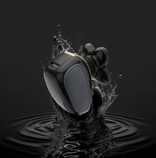 Black wireless electric shaver splashing into water on a black background